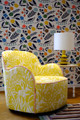 Chair upholstered in Fleur Étoilées Lemon, set against Array wallpaper from the Makoto Kagoshima collection. A sunlit interior designed by Popus, filled with joyful pattern and harmony.